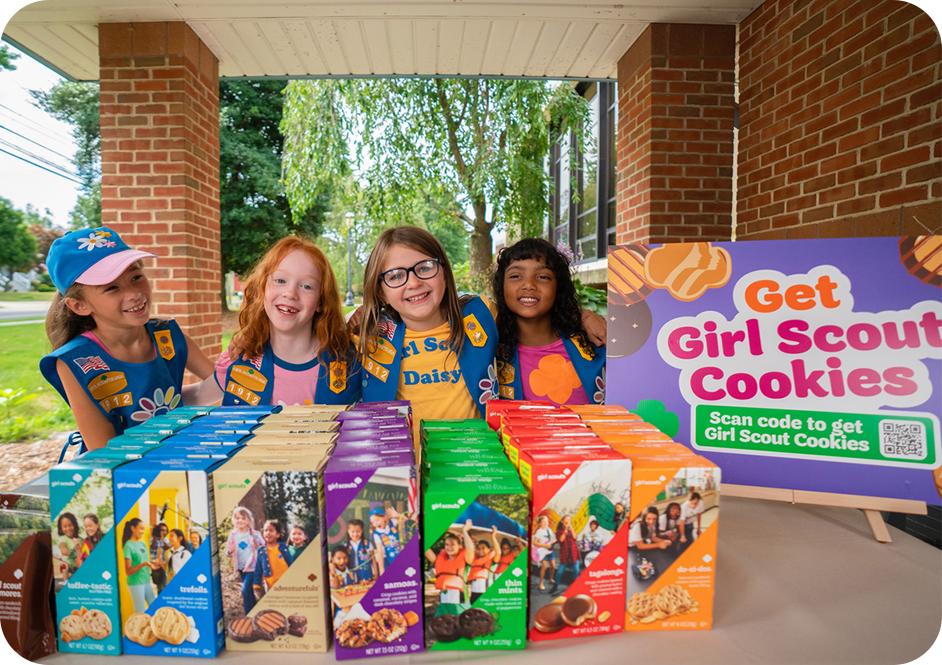 Four girls at a cookie booth