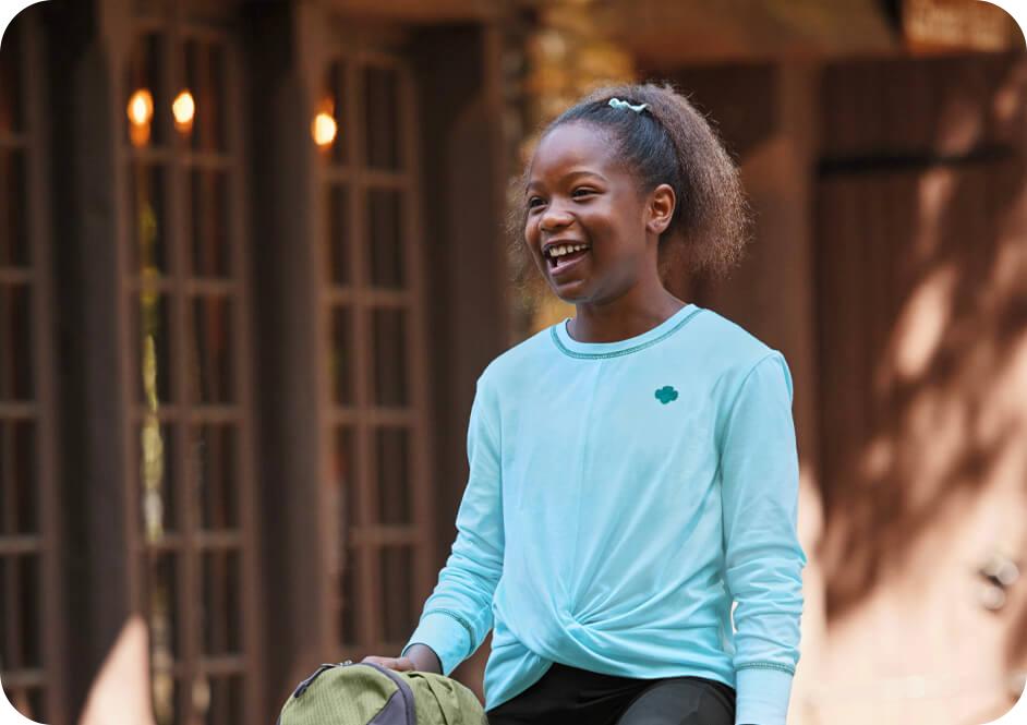 Girl wearing light blue long sleeve shirt