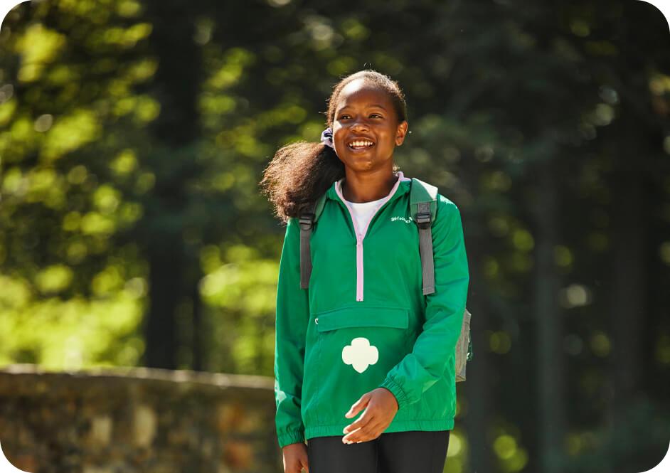 Girl wearing green Girl Scouts jacket